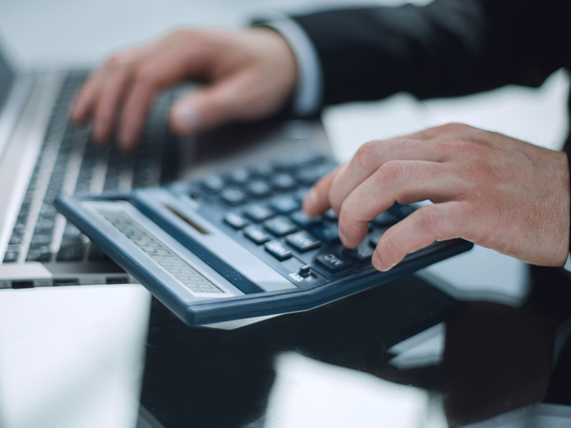 man computing using a calculator