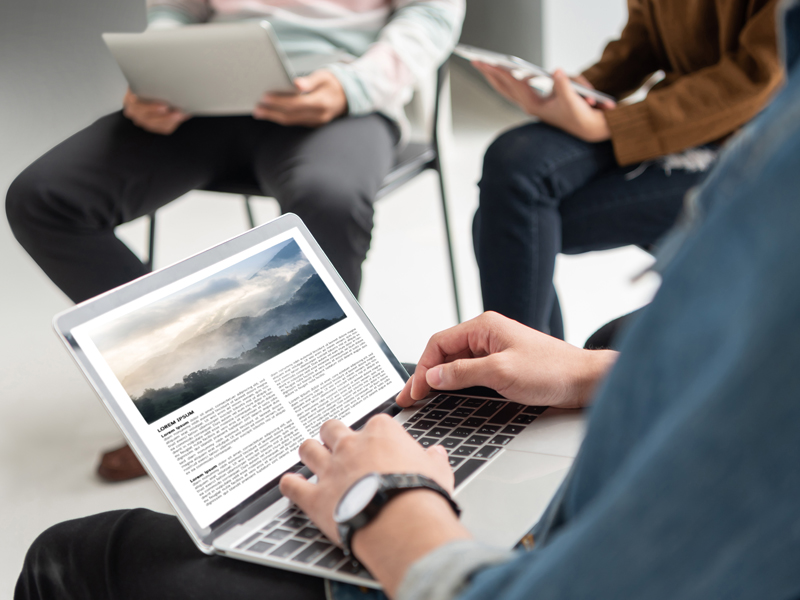 man typing on laptop