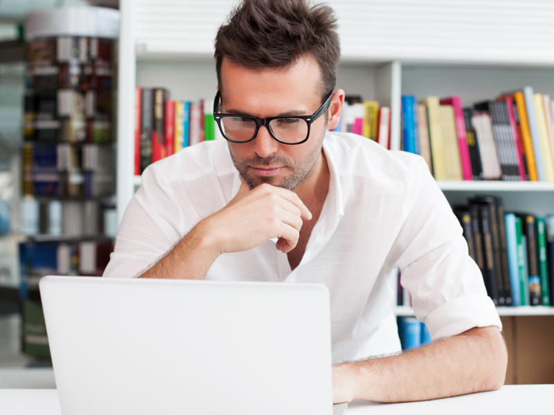 man in laptop thinking about tax