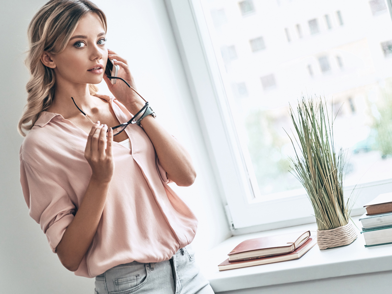 woman talking with someone over the phone