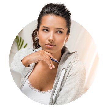 Thoughtful young woman holding a pen and looking away
