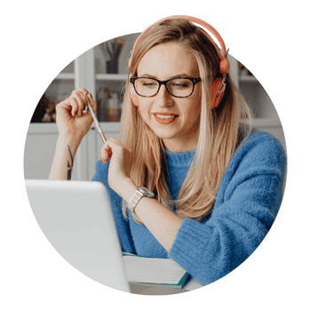 Freelancer at a desk looking at the laptop